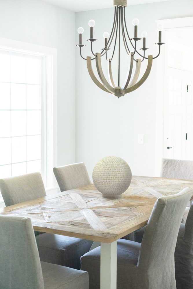 Stunning round white glass table lamp with a wooden base
