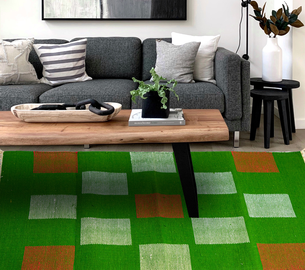 Green with white and red dhurrie for your living space